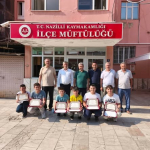 NAZİLLİ'DE HAFIZLIĞINI TAMAMLAYAN ÖĞRENCİLERE BELGELERİ VERİLDİ